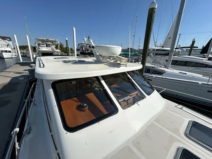 N'baluba Yacht Photos Pics 2008 Rivolta Coupe 4.5 yacht docked at marina, showcasing sleek design and modern features.