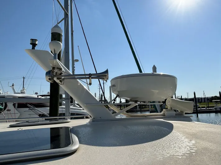N'baluba Yacht Photos Pics 2008 Rivolta Coupe 4.5 yacht deck with radar and horn under clear sky.