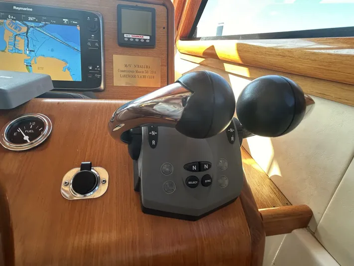 N'baluba Yacht Photos Pics Control panel of a 2008 Rivolta Coupe 4.5 with navigation display and throttle levers.