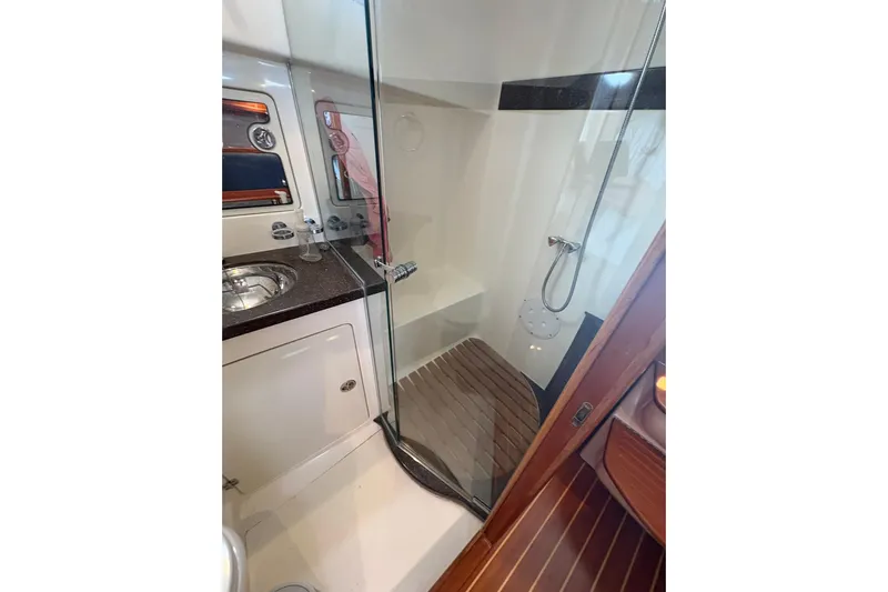 N'baluba Yacht Photos Pics Luxurious bathroom interior of 2008 Rivolta Coupe 4.5 with modern shower and sink.