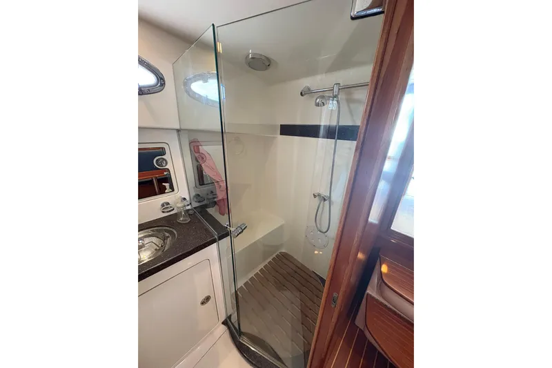 N'baluba Yacht Photos Pics Luxurious bathroom in 2008 Rivolta Coupe 4.5 yacht with glass shower and modern fixtures.