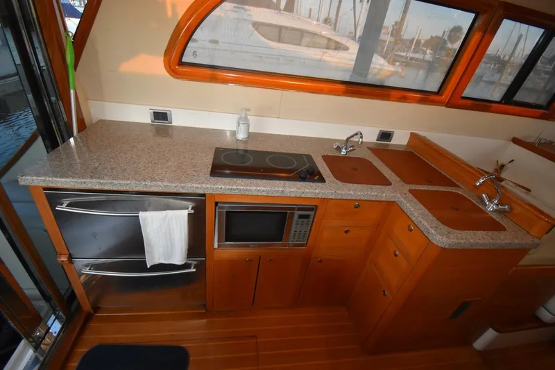 N'baluba Yacht Photos Pics Luxurious kitchen interior of 2008 Rivolta Coupe 4.5 yacht with modern appliances.