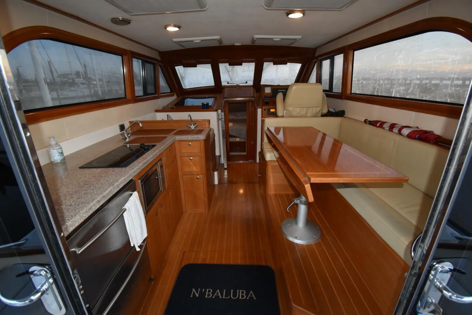 Luxurious interior of 2008 Rivolta Coupe 4.5 yacht with kitchen and seating area.