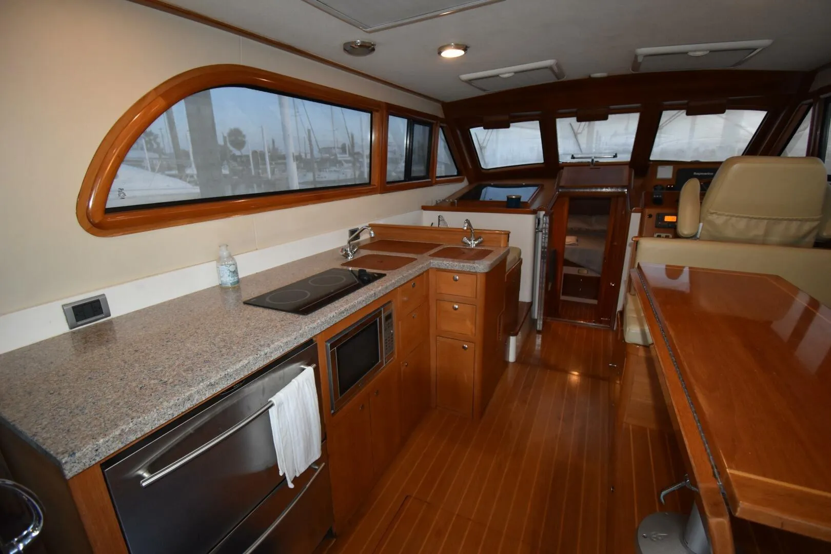 Luxurious interior of 2008 Rivolta Coupe 4.5 yacht with modern kitchen and helm.
