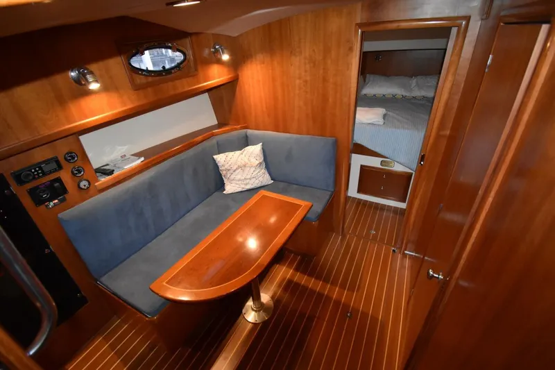 N'baluba Yacht Photos Pics Luxurious 2008 Rivolta Coupe 4.5 yacht interior with cozy seating and elegant wood finish.