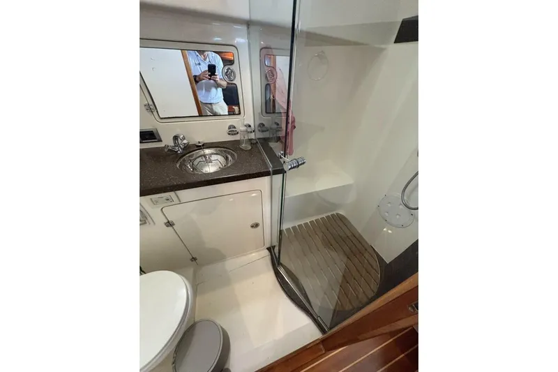 N'baluba Yacht Photos Pics Luxurious bathroom interior of 2008 Rivolta Coupe 4.5 with modern fixtures and glass shower.