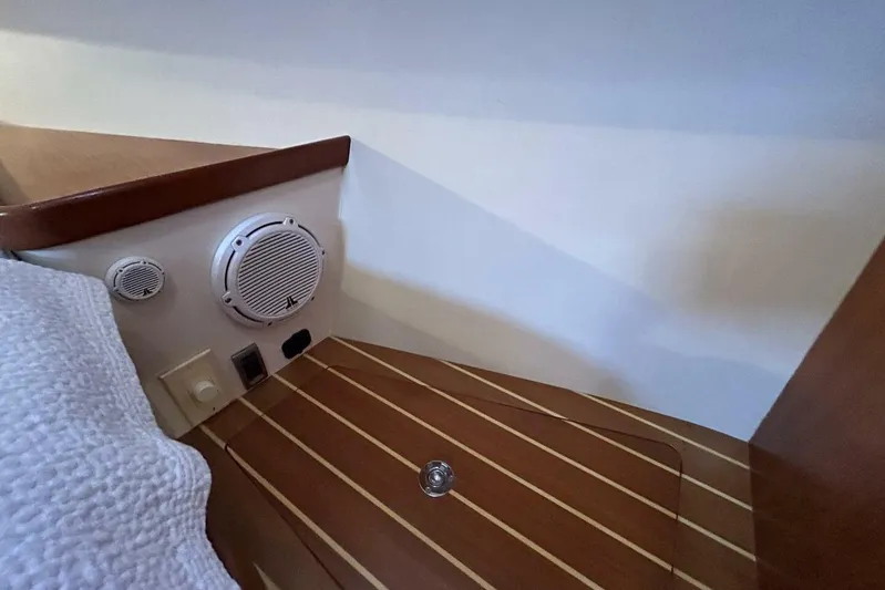 N'baluba Yacht Photos Pics Interior of 2008 Rivolta Coupe 4.5, featuring wood paneling and built-in speaker system.