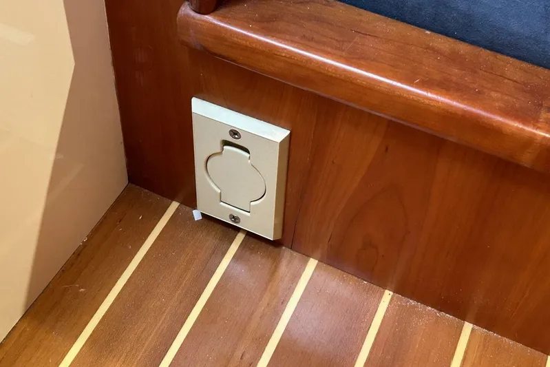 N'baluba Yacht Photos Pics Wooden interior of 2008 Rivolta Coupe 4.5 with unique wall outlet design.