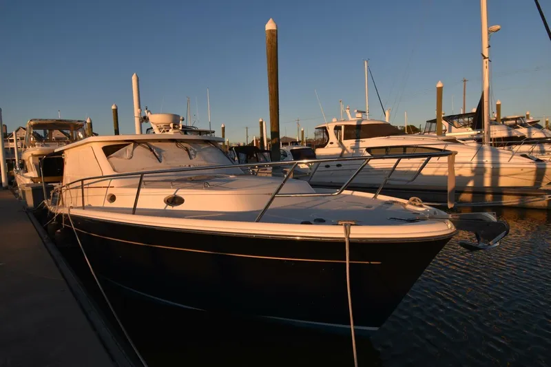 N'baluba Yacht Photos Pics 2008 Rivolta Coupe 4.5 yacht docked at marina during sunset.