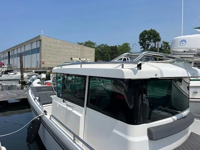  Yacht Photos Pics 2019 Axopar 28 boat docked at marina with modern design and sleek windows.