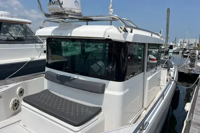  Yacht Photos Pics 2019 Axopar 28 boat docked at marina, featuring sleek design and modern amenities.