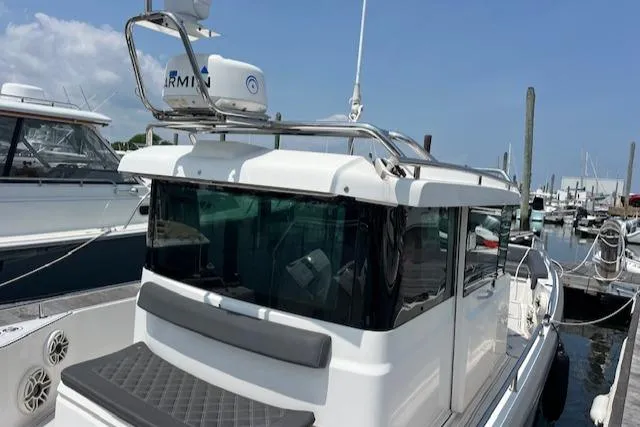  Yacht Photos Pics 2019 Axopar 28 boat docked at marina, featuring sleek design and modern equipment.