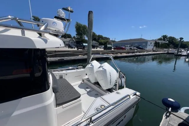  Yacht Photos Pics 2019 Axopar 28 boat docked at marina with outboard motor.