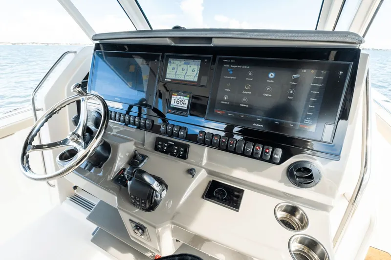 Pirates Bight Yacht Photos Pics Helm of 2019 Pursuit 408 boat with advanced navigation displays and controls.