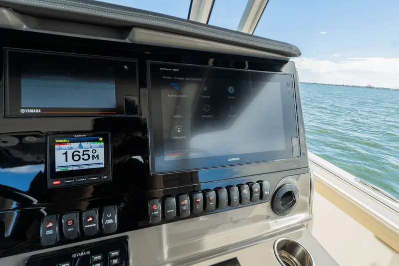 Pirates Bight Yacht Photos Pics Helm of 2019 Pursuit 408 boat with Garmin navigation displays and Yamaha controls.