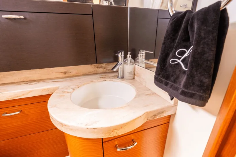 Pirates Bight Yacht Photos Pics Luxurious bathroom sink in 2019 Pursuit 408 yacht with elegant fixtures and cabinetry.