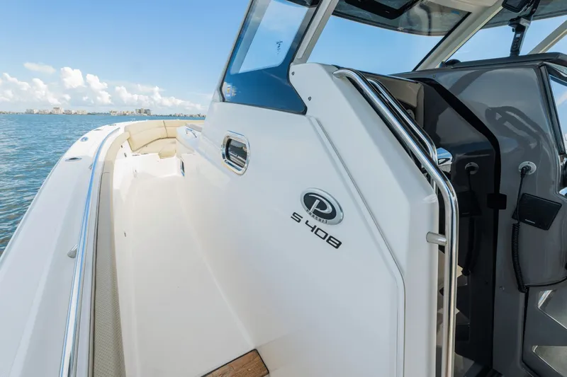 Pirates Bight Yacht Photos Pics 2019 Pursuit 408 boat on water, showcasing sleek design and spacious deck.