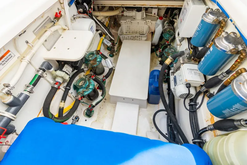 Pirates Bight Yacht Photos Pics Engine room of 2019 Pursuit 408 boat, showcasing mechanical components and systems.