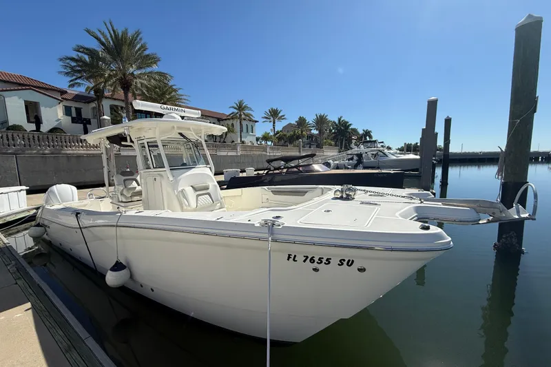  Yacht Photos Pics 2021 World Cat 295 CC boat docked in sunny marina setting.