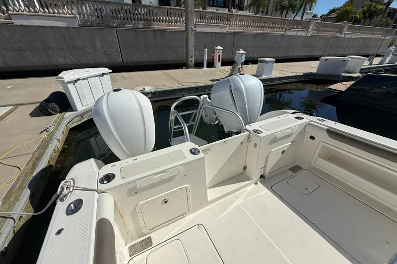  Yacht Photos Pics 2021 World Cat 295 CC boat docked with dual outboard engines.