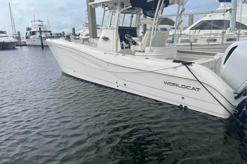 Yacht Photos Pics 2021 World Cat 295 CC boat docked in marina, side view.