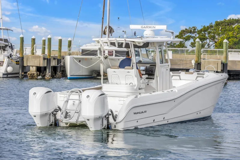  Yacht Photos Pics 2021 World Cat 295 CC boat docked, featuring dual outboard engines.