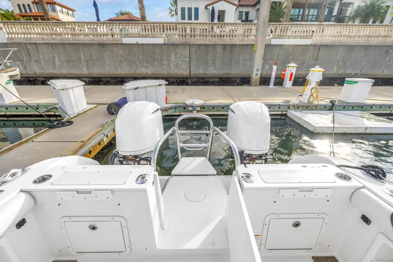  Yacht Photos Pics 2021 World Cat 295 CC boat docked, featuring dual outboard engines and spacious deck.