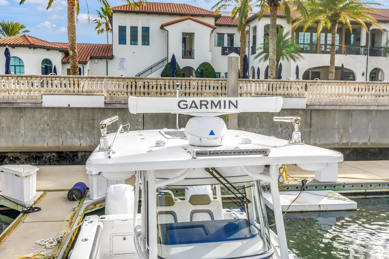  Yacht Photos Pics 2021 World Cat 295 CC boat docked near luxury waterfront homes.