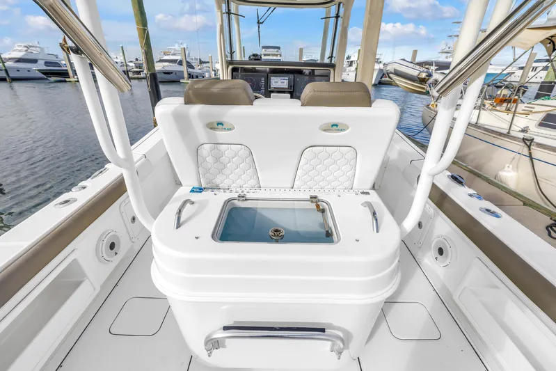  Yacht Photos Pics 2021 World Cat 295 CC boat interior with seating and storage at marina.
