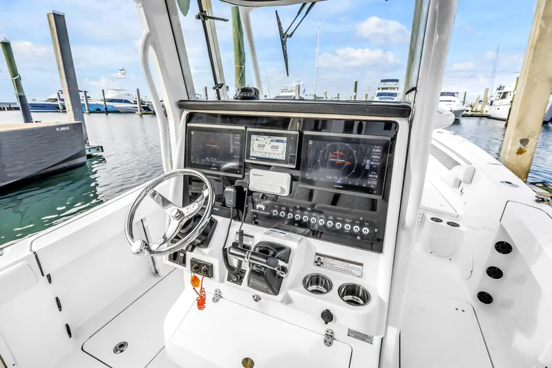  Yacht Photos Pics 2021 World Cat 295 CC boat dashboard with advanced navigation and control systems.