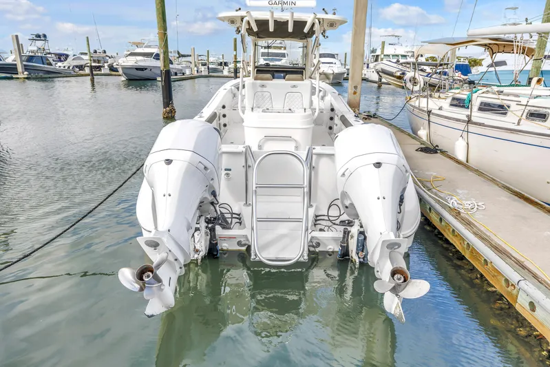  Yacht Photos Pics 2021 World Cat 295 CC boat docked with twin outboard engines.