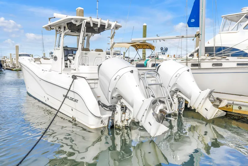  Yacht Photos Pics 2021 World Cat 295 CC boat docked with dual outboard engines.