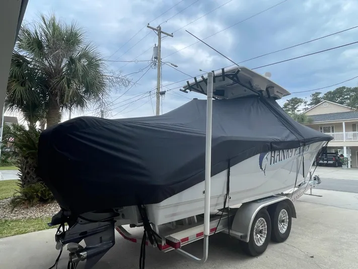  Yacht Photos Pics 2024 Sea Fox 288 Commander boat covered on a trailer, parked outdoors.
