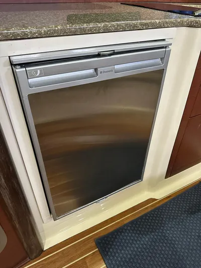  Yacht Photos Pics Stainless steel fridge in 2010 Boston Whaler 345 Conquest boat interior.