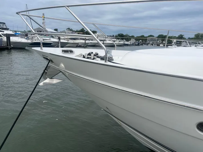 C Glass Yacht Photos Pics Bow of a 2000 Princess 65 M/Y yacht docked in a marina.