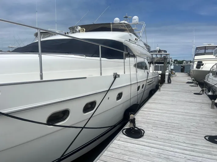 C Glass Yacht Photos Pics Luxury Princess 65 M/Y yacht docked at marina, 2000 model, clear sky background.