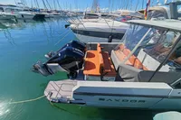 Saxdor 320 GTO boat with twin Mercury 300 V8 engines docked in marina, 2022 model.