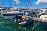 2022 Saxdor 320 GTO with Twin Mercury 300 V8 engines docked in marina.