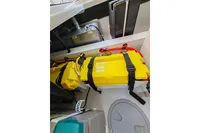Yellow battery compartment in 2022 Saxdor 320 GTO boat, featuring Twin Mercury 300 V8 engines.