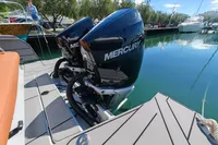 Twin Mercury 300 V8 engines on a 2022 Saxdor 320 GTO, docked in a marina.