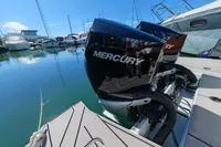 Twin Mercury 300 V8 engines on a 2022 Saxdor 320 GTO, docked at a marina.