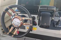 Steering wheel and controls of 2022 Saxdor 320 GTO with Twin Mercury 300 V8 engines.