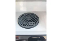 Wireless charging pad on 2022 Saxdor 320 GTO boat, featuring a honeycomb design.