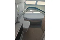 2022 Saxdor 320 GTO cabin interior with bed and seating area.