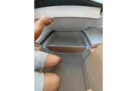 Interior storage compartment of 2022 Saxdor 320 GTO boat, showcasing spacious design.