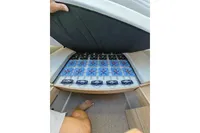Under-seat storage in 2022 Saxdor 320 GTO boat, showcasing organized compartments.