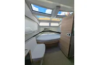 Interior of 2022 Saxdor 320 GTO boat with skylights and modern seating.