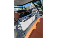 Interior of 2022 Saxdor 320 GTO boat with modern seating and sleek design.