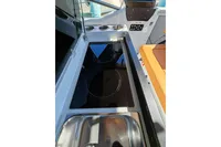 Interior of 2022 Saxdor 320 GTO boat with modern kitchen amenities.