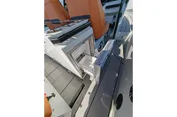 2022 Saxdor 320 GTO boat interior with open drawer and seating.